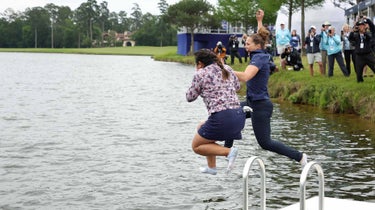 Lilia Fu (left) of the United States jumps into the water after winning a one-hole playoff against Angel Yin (not pictured) of the United States during the final round of the Chevron Championship at The Club at Carlton Woods on April 23, 2023 in The Woodlands, Texas .