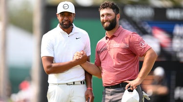 Tony Finau (L) of the United States shakes hands with Spaniard John Rahm (R) after winning the Mexico Open at Vedanta on April 30, 2023 in Puerto Vallarta, Jalisco.