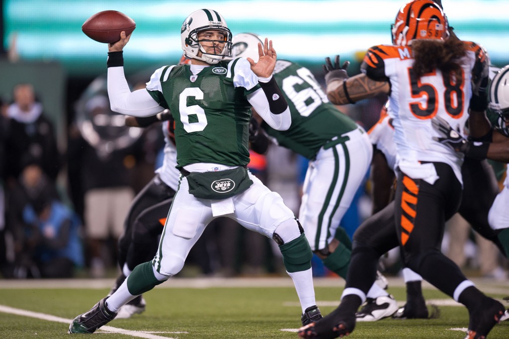 Quarterback Mark Sanchez #6 of the New York Jets falls back for a pass against the Cincinnati Bengals on November 25, 2010 at New Meadowlands Stadium in East Rutherford, New Jersey.  The Jets defeated the Bengals 26 to 10. 