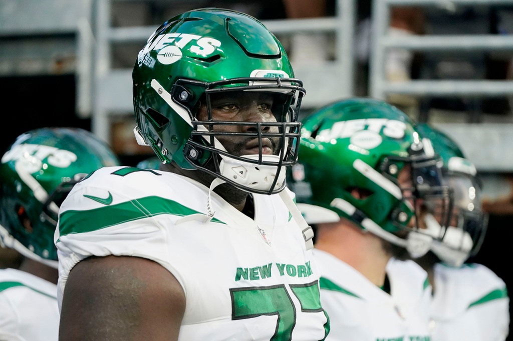 New York Jets offensive tackle Mekhi Becton waits to take the field before an NFL preseason football game against the New York Giants, August 14, 2021, in East Rutherford, NJ 