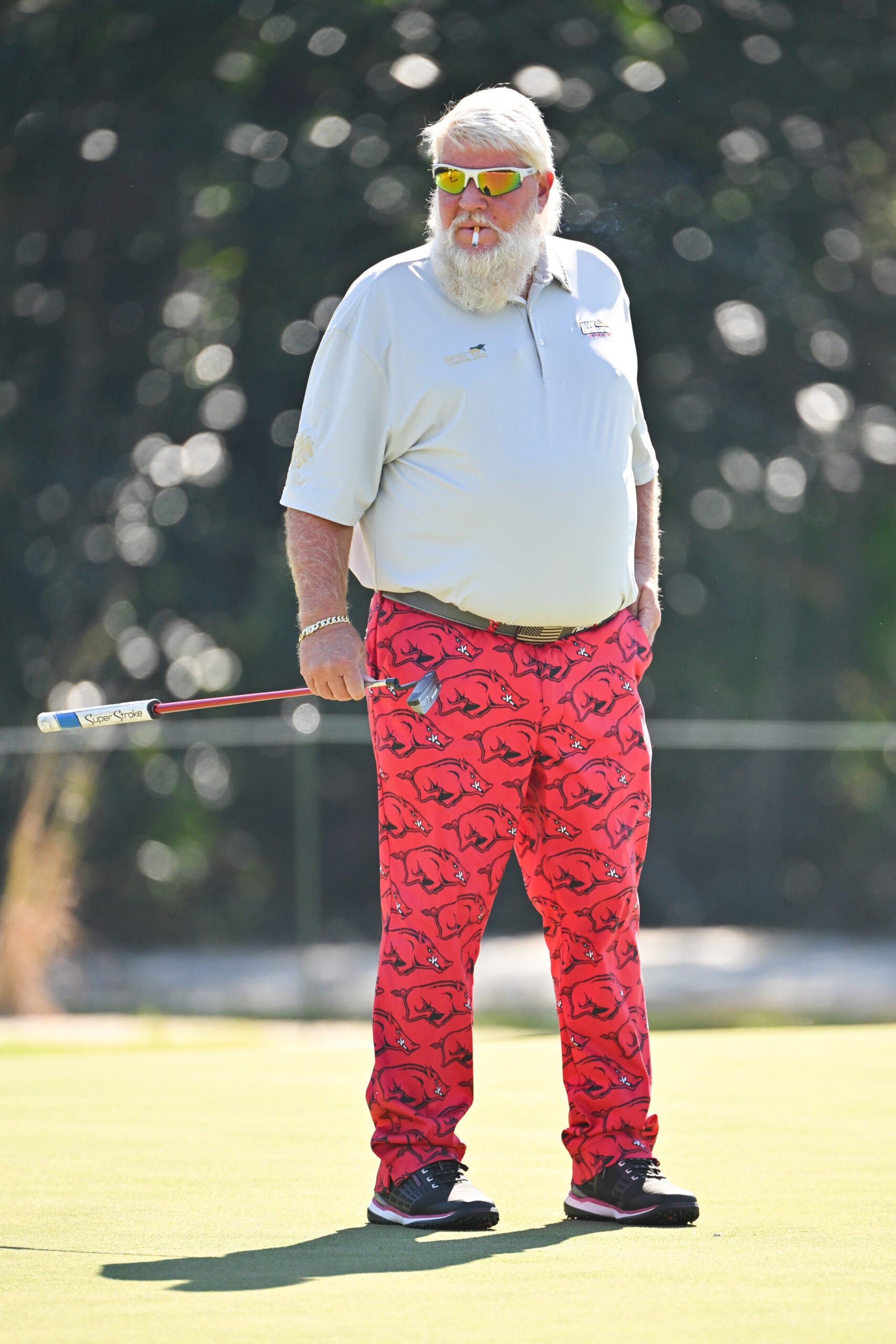 PONTVEDRA BEACH, FL - OCTOBER 8: John Daly smokes a cigarette while playing on the first green during the second round of the PGA TOUR Champions Constellation FURYK & FRIENDS presented by Circle K at Timuquana Country Club on October 8, 2022 in Jacksonville, Florida.  (Photo by Ben Jared/PGA Tour via Getty Images)