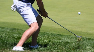 The player hits the ball rough