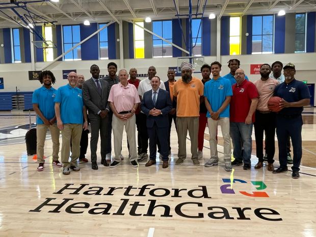 The Greater Hartford Pro-Am organizers and participants along with Jim Calhoun and the directors of Hartford Healthcare are at Jim Calhoun Gymnasium to celebrate the event's 25th anniversary.  (Joe Arruda/Hartford Courant)