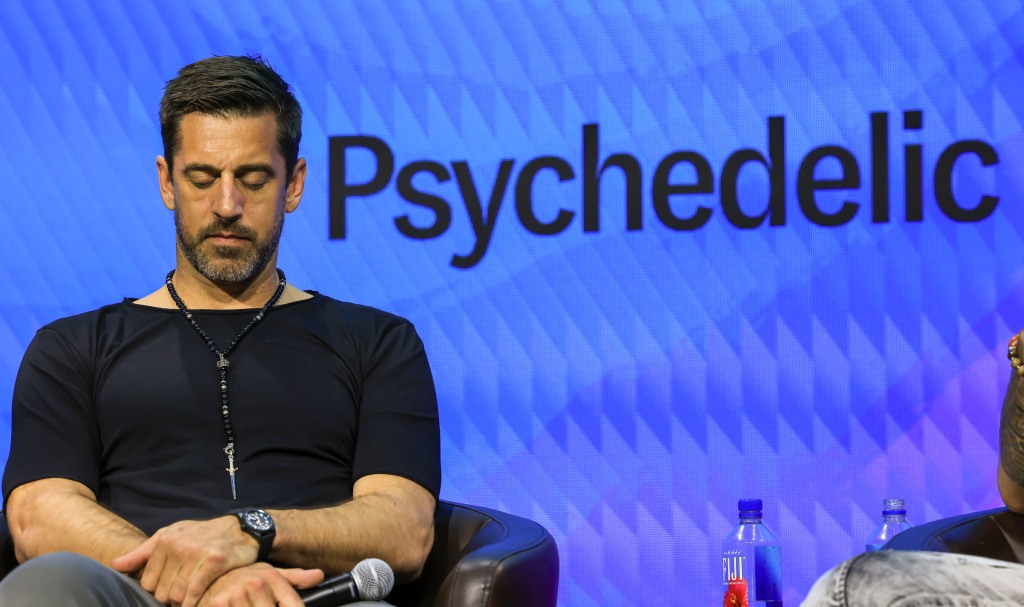 Aaron Rodgers listens to a prayer during the main session "How drugs can unlock elite performance" At a psychedelic science conference in Denver on June 21.