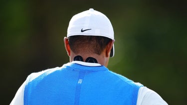 After getting up with a stiff neck, Tiger Woods applied KT Tape for his first round at Carnoustie.