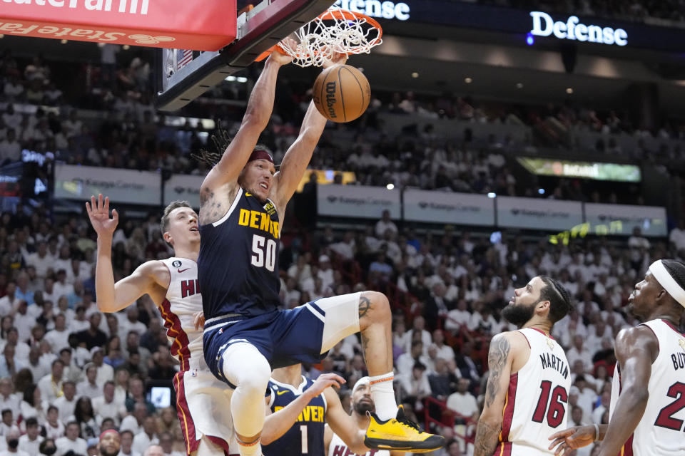 Denver Nuggets forward Aaron Gordon (50) dunks the ball during the first half of Game 4 of the NBA Finals against the Miami Heat, Friday, June 9, 2023, in Miami.  (AP Photo/Wilfredo Lee)