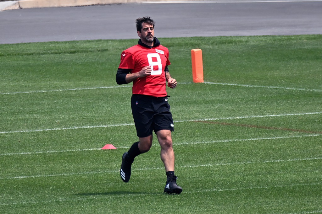 Jets quarterback Aaron.  Rodgers runs while training at OTA in Florham Park, NJ.
