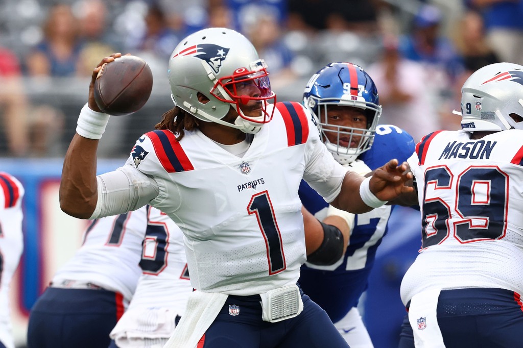 Cam Newton #1 of the New England Patriots looks to pass the ball against the New York Giants at MetLife Stadium on August 29, 2021 in East Rutherford, New Jersey. 