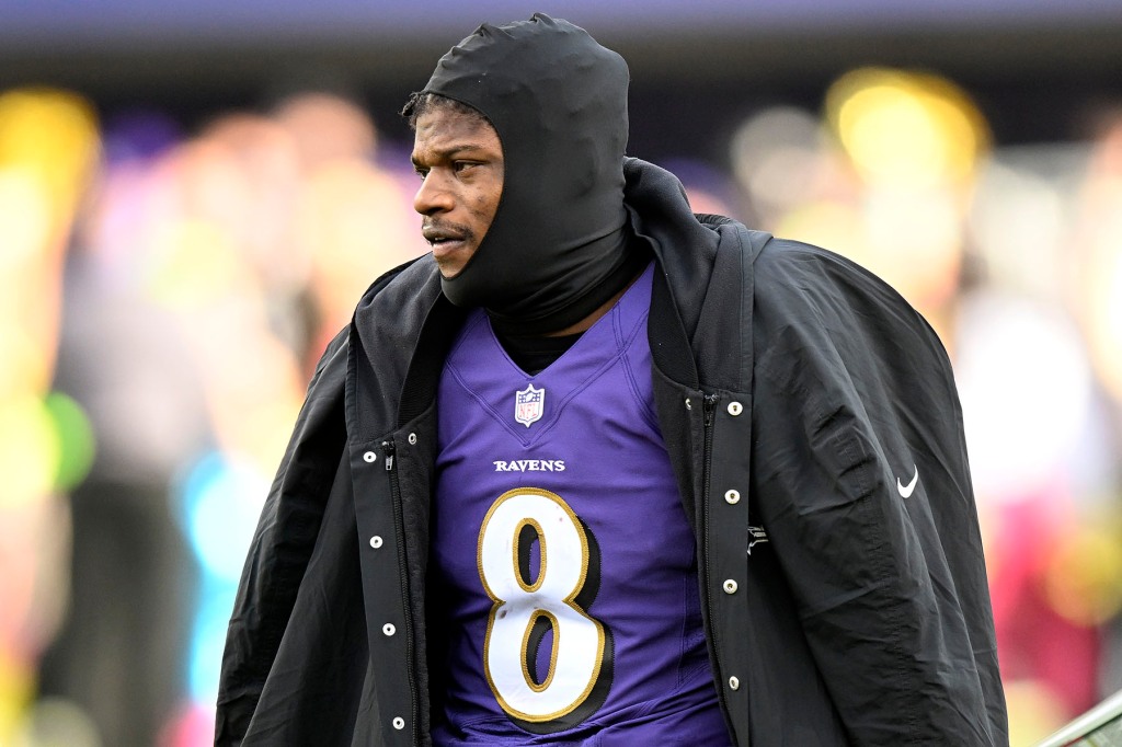 Lamar Jackson #8 of the Baltimore Ravens watches the game against the Denver Broncos at M&T Bank Stadium on December 04, 2022 in Baltimore, Maryland. 