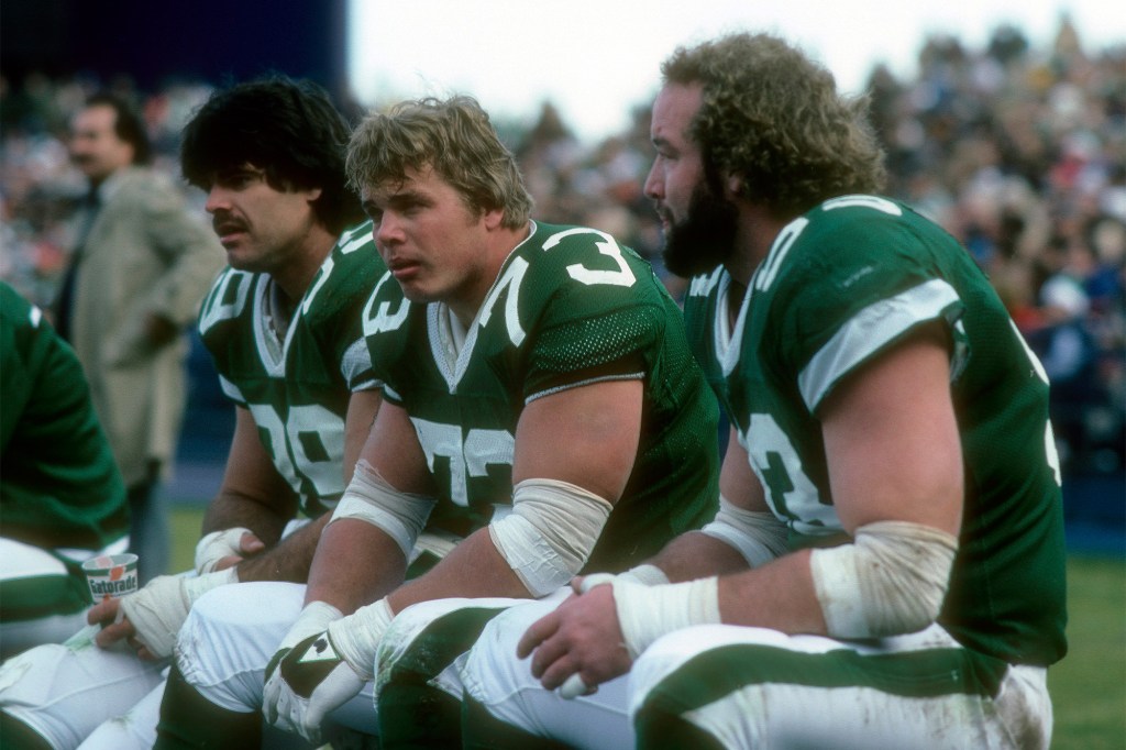 Joe Klecko sits between Mark Gastineau (l) and Marty Lyons (r.) during a Jets game around 1983.