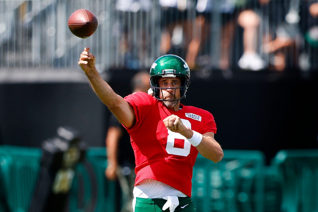 New York Jets quarterback Aaron Rodgers (8) throws the ball during training camp in Florham Park, N.J. Sunday, July 30, 2023.