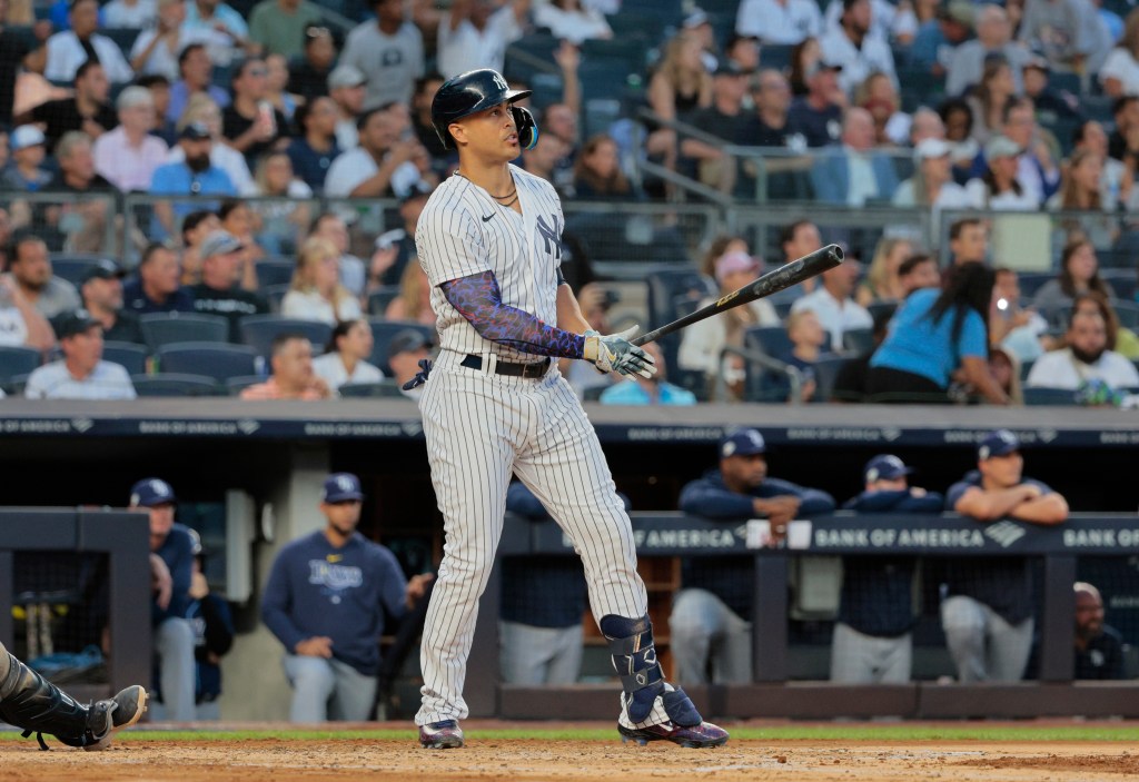 Giancarlo Stanton watches his home run during the Yankees' win over the Rays.