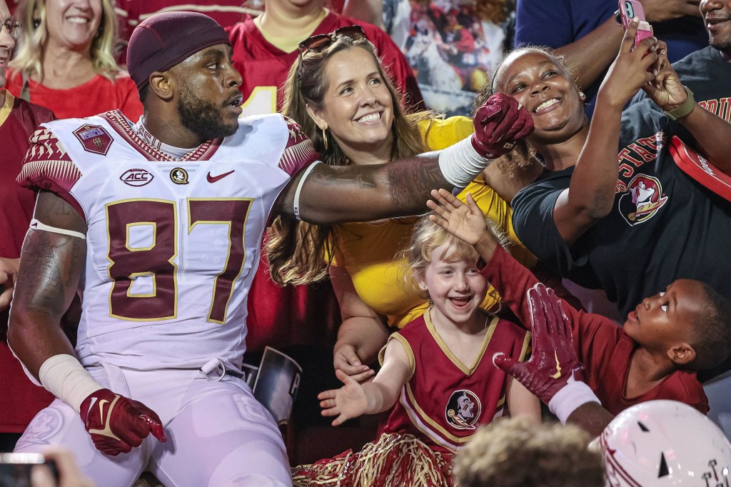 Camren McDonald #87 of the Florida State Seminoles celebrates with fans after the game against the Louisville Cardinals at Cardinal Stadium on September 16, 2022 in Louisville, Kentucky. 