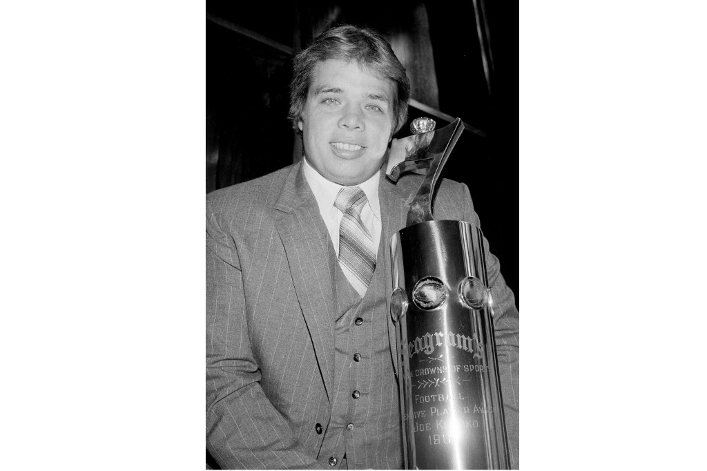 Klecko poses with the Seagram's Seven Crowns of Sports award for outstanding defensive player in the National Football League, in New York, Feb. 16, 1982. 