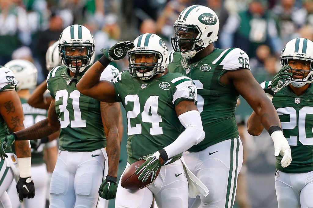 Darrelle Revis reacts with his Jets teammates following an interception during a 2015 game.