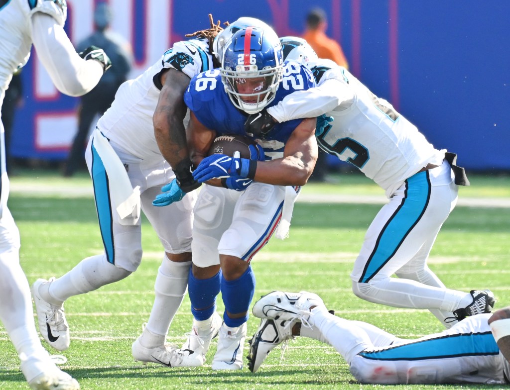 The Giants' Saquon Barkley runs against the Panthers. 