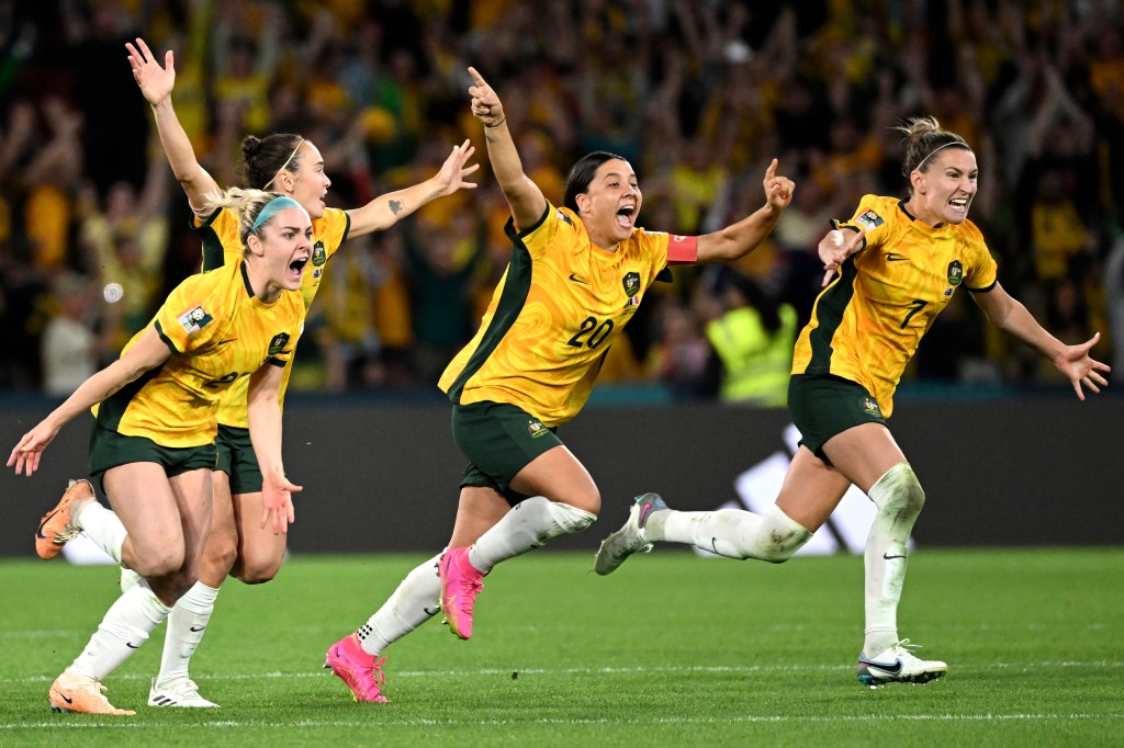 Australia players celebrate after winning a penalty-kick shootout against France to reach the 2023 World Cup semifinals.