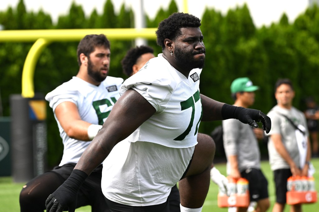 The Jets know Mekhi Becton, stretching during a recent practice, and the rest of the offensive line has to get better before the regular season starts.