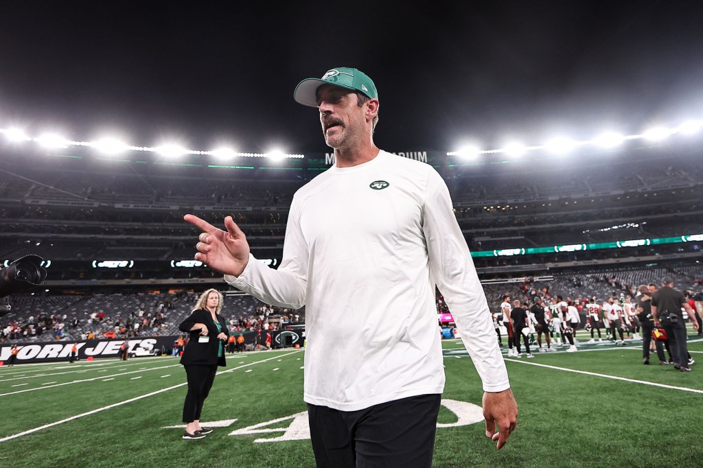 Aaron Rodgers #8 of the New York Jets walks off the field after the preseason game against the Tampa Bay Buccaneers at MetLife Stadium on August 19, 2023 in East Rutherford, New Jersey. 