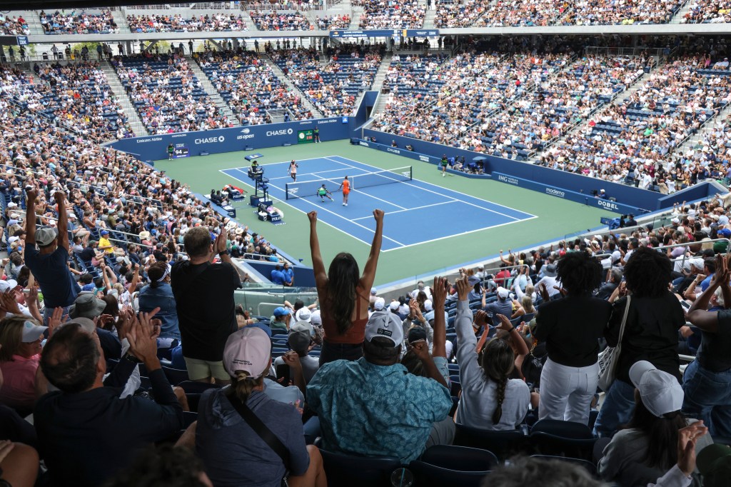 Fans cheer during a match between Beatriz Haddad Maia, of Brazil, and Sloane Stephens, of the United States in the first round. 