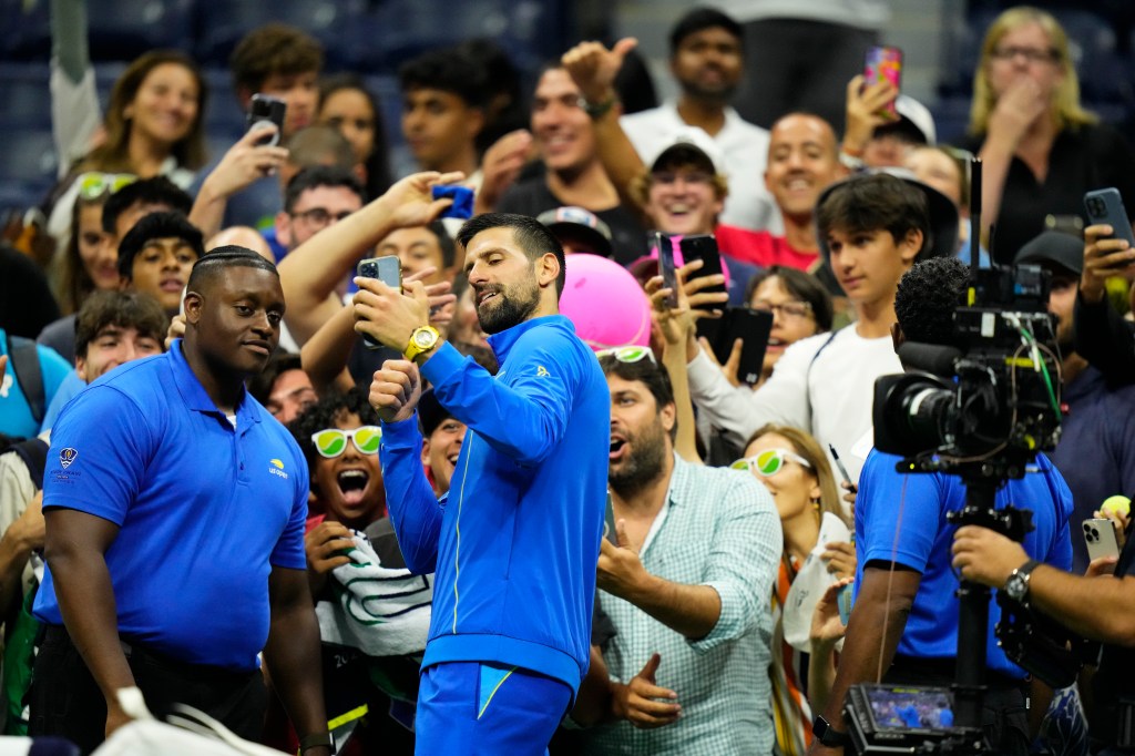 Novak Djokovic interacts with fans at the U.S. Open.  