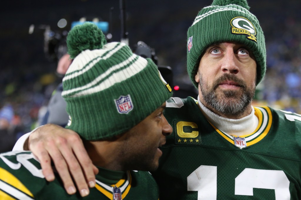 Aaron Rodgers and Randall Cobb walk off the field after a game between the Green Bay Packers and the Detroit Lions at Lambeau Field for the last time.