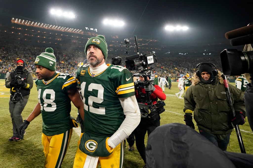 Aaron Rodgers and Randall Cobb walk off the field after losing to the Detroit Lions at Lambeau Field.