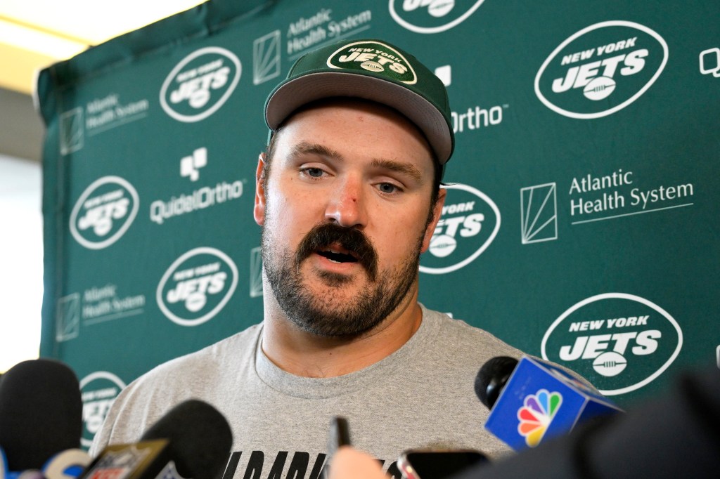 Jets center Connor McGovern speaks with the media