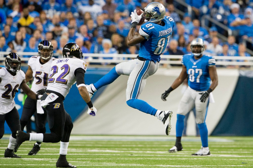 Wide receiver Calvin Johnson #81 of the Detroit Lions catches a pass during the second half against the Baltimore Ravens at Ford Field on December 16, 2013 in Detroit, Michigan. The Ravens defeated the Lions 18-16. 