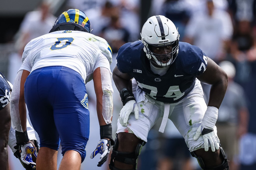 Olumuyiwa Fashanu #74 of the Penn State Nittany Lions lines up against Jackson Taylor #0 of the Delaware Fightin Blue Hens during the first half at Beaver Stadium on September 9, 2023 in State College, Pennsylvania. 