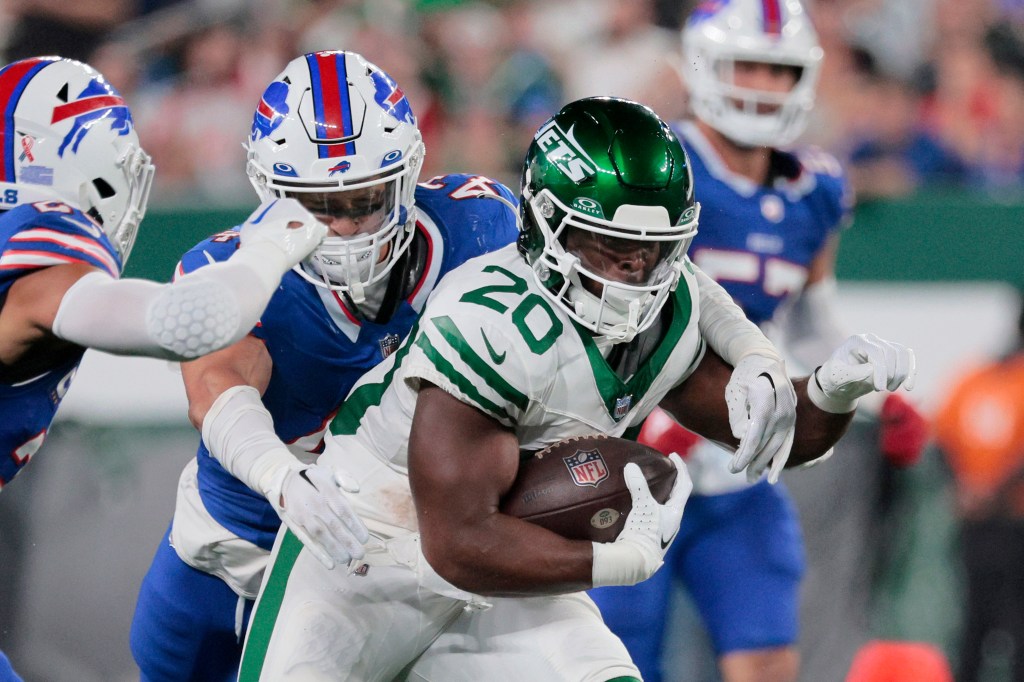 Jets running back Breece Hall carries the ball against the Bills.