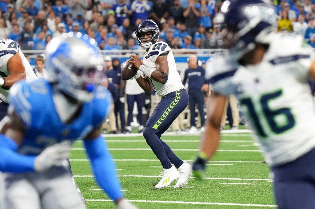 Quarterback Geno Smith #7 of the Seattle Seahawks looks to throw the ball during the first half of an NFL football game against the Detroit Lions at Ford Field on September 17, 2023 in Detroit, Michigan. 