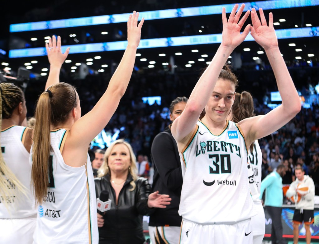 The Liberty's Sabrina Ionescu and Breanna Stewart acknowledge the Barclays Center crowd.