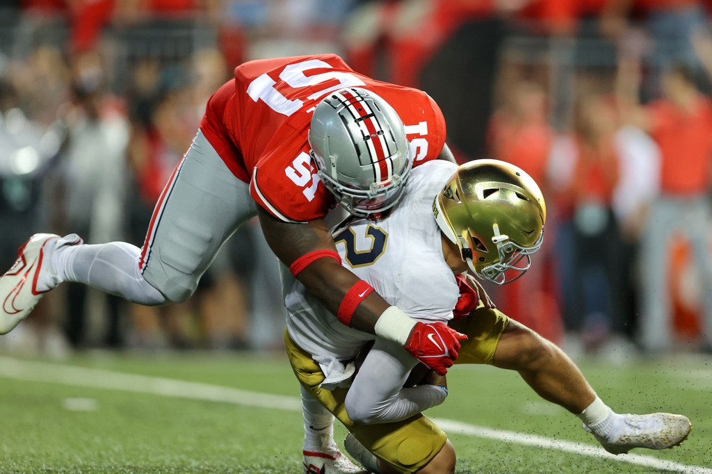 Ohio State Buckeyes defensive tackle Michael Hall Jr. (51) sacls Notre Dame Fighting Irish quarterback Tyler Buchner (12) during the fourth quarter of the college football game between the Notre Dame Fighting Irish and Ohio State Buckeyes on September 3, 2022, at Ohio Stadium in Columbus, OH.