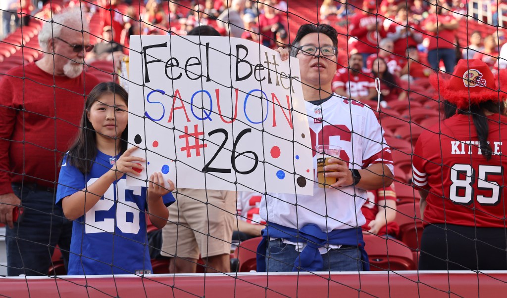 Giants fans hold up a sign for Saquon Barkley at Levi's Stadium