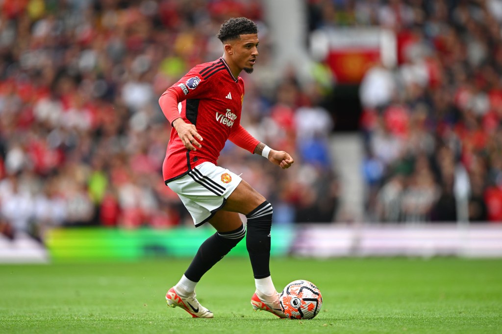 Jadon Sancho controls the ball for Manchester United.