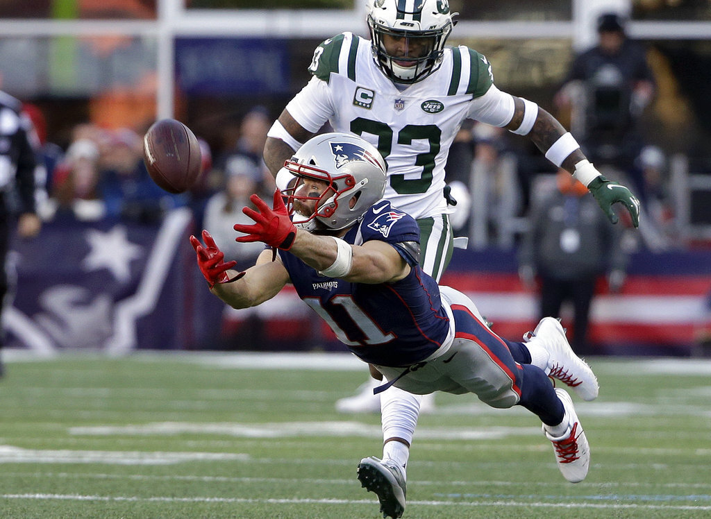 Julian Edelman (11) stretches but cannot catch a pass in front of New York Jets safety Jamal Adams