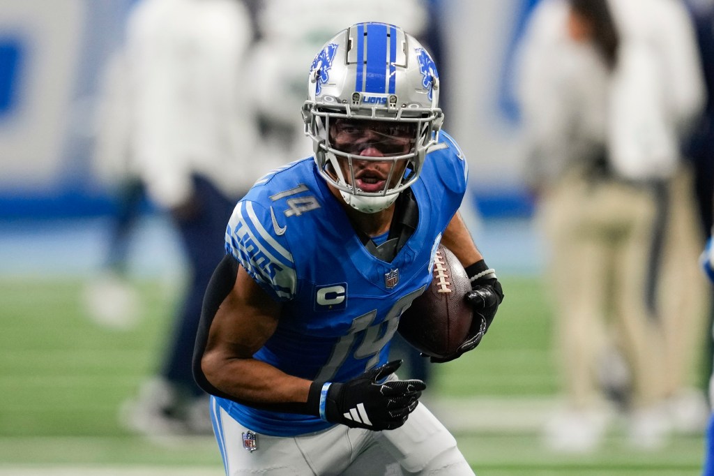 Detroit Lions wide receiver Amon-Ra St. Brown (14) catches a pass before an NFL football game against the Seattle Seahawks in Detroit, Sunday, Sept. 17, 2023.