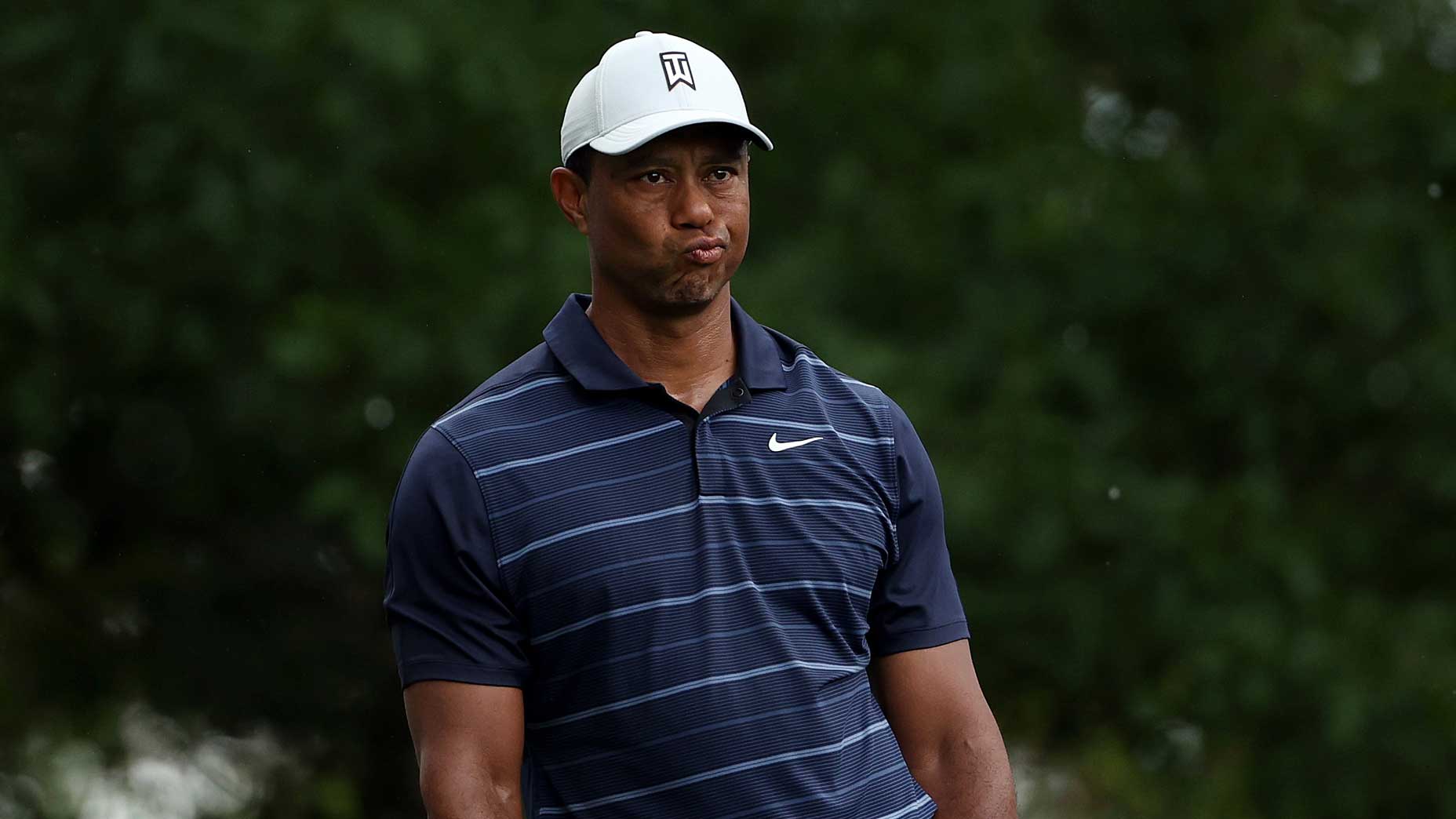 Tiger Woods looks at camera during Masters tournament