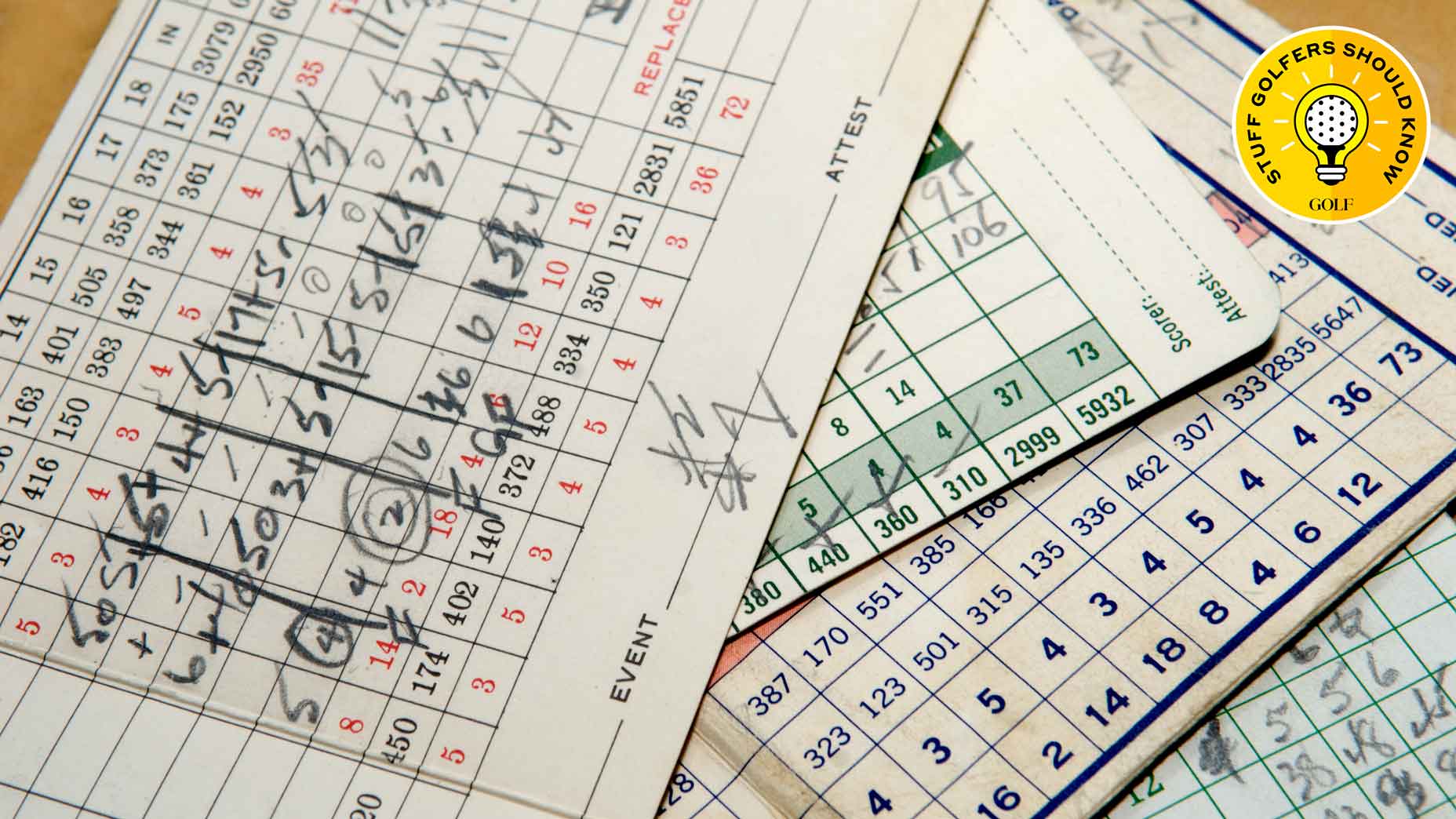 A stack of golf scorecards