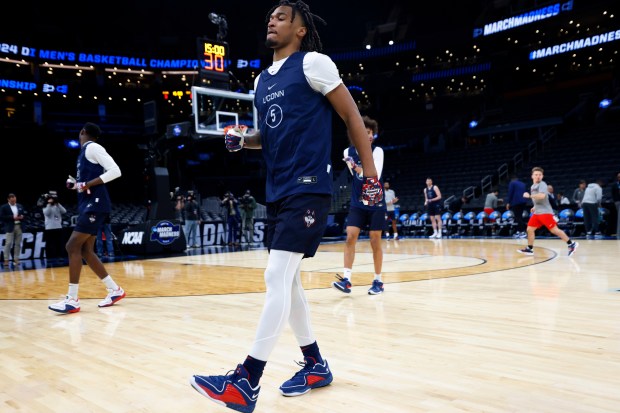 Boston, MA- March 27: UConn's Stephon Castle warms up during a practice for a Sweet 16 game against San Diego State at the TD Garden on Wednesday, March 27, 2024 in Boston, MA. (K.C. Alfred / The San Diego Union-Tribune)