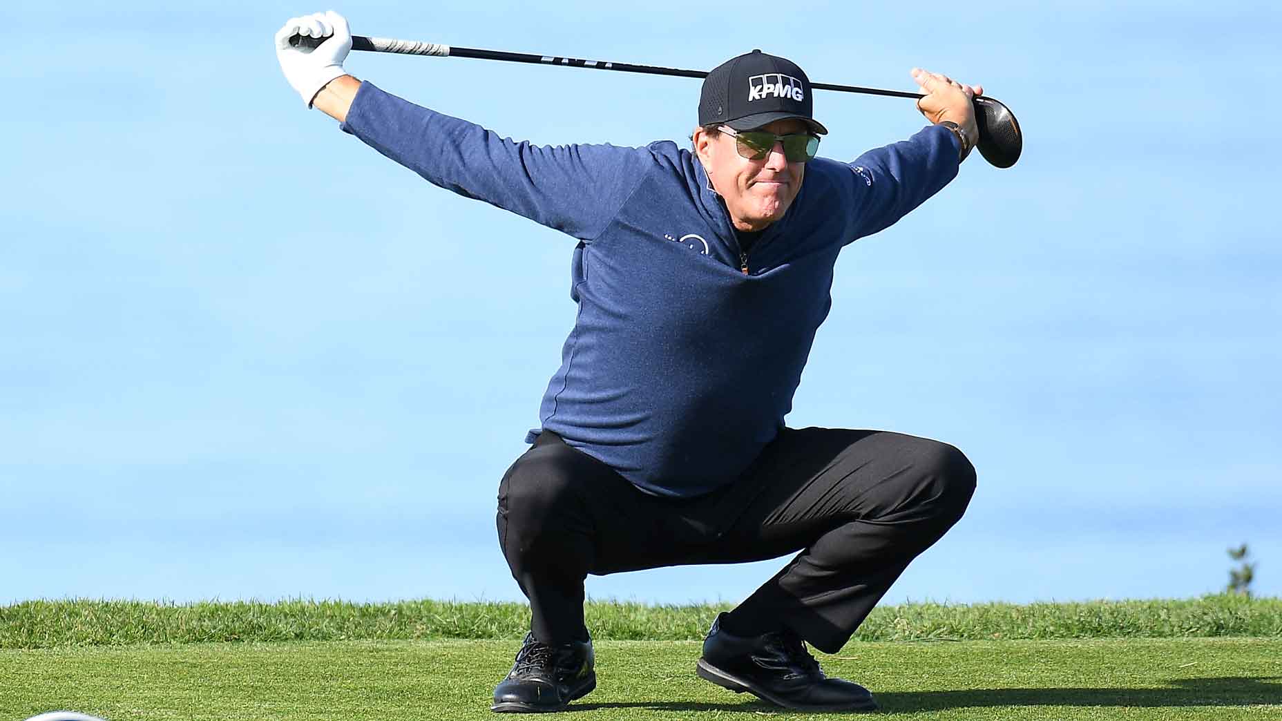 Phil Mickelson stretches on the 11th hole on the North Course during the first round of the Farmers Insurance Open golf tournament at Torrey Pines Municipal Golf Course on January 28, 2021